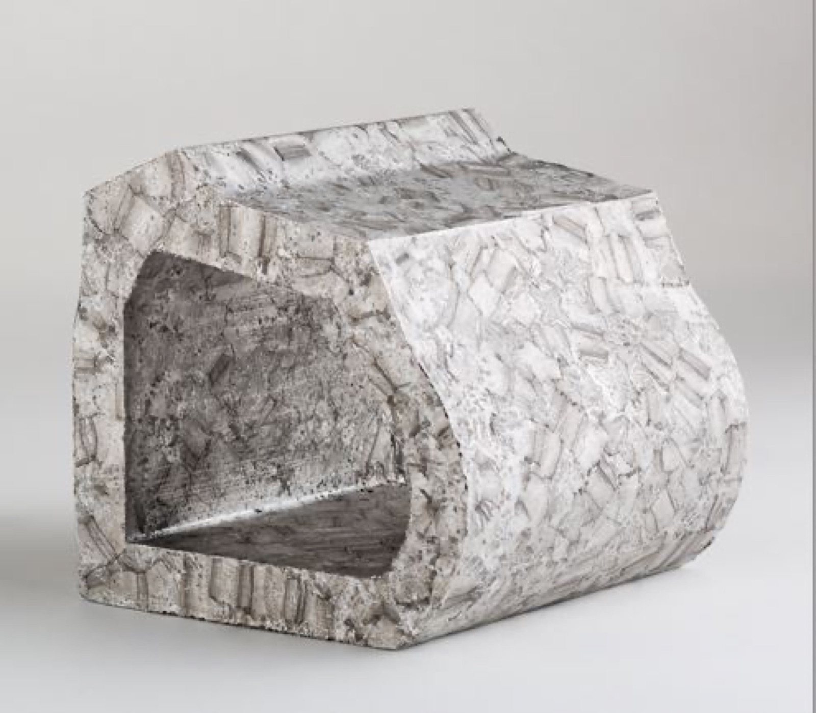 A tunnel-shaped element of aluminum foam with a continuous rectangular channel; the outer surfaces are coarsely faceted, the inner surfaces of the channel smoother.